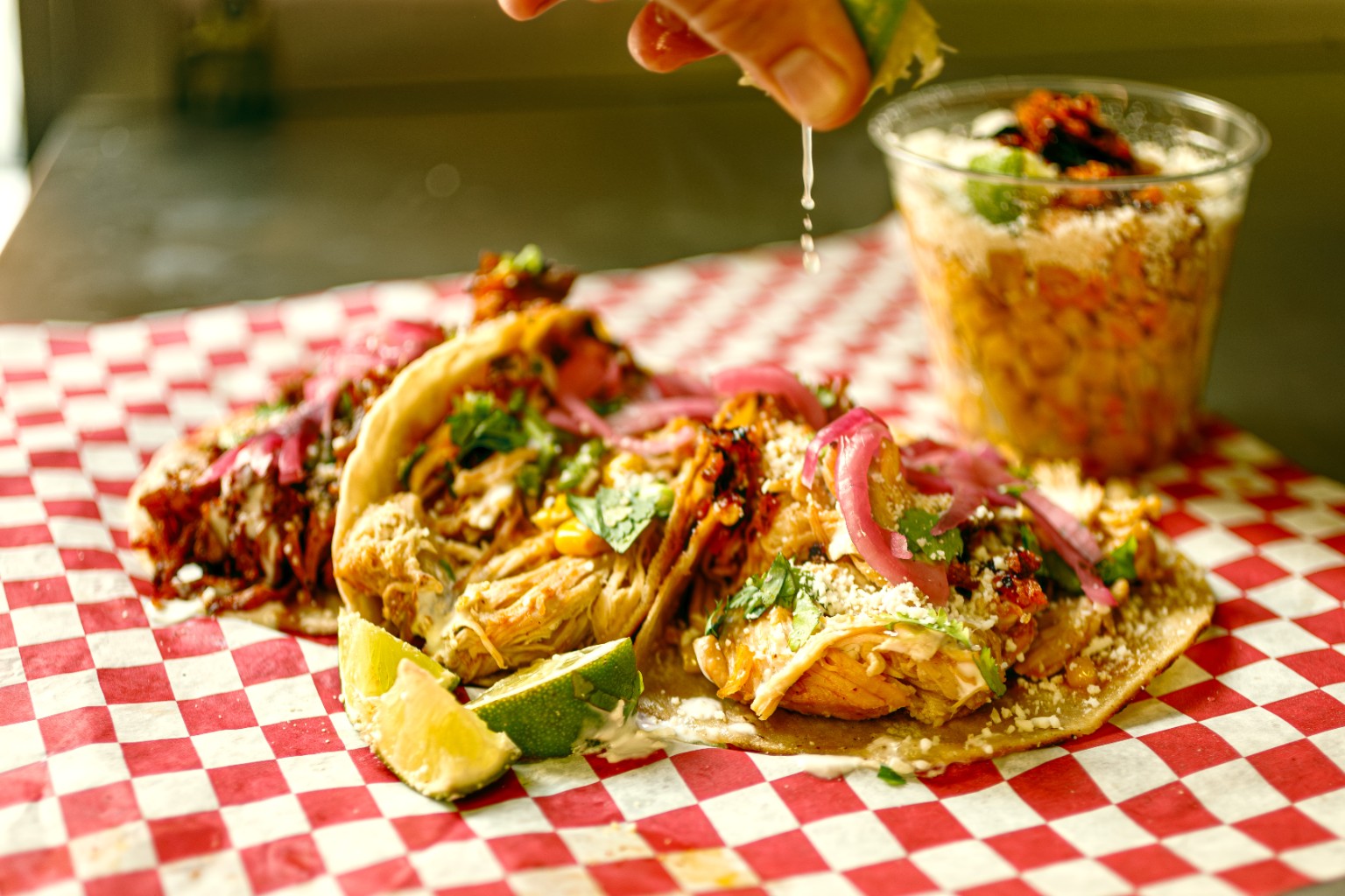 Tacos on red and white checkered paper